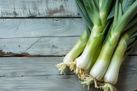 Fresh leeks on wooden backgroundの素材