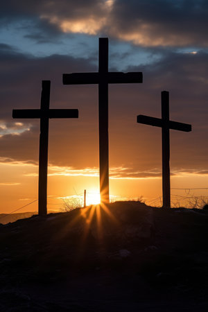 Silhouettes of crosses against a dramatic sunset skyの素材