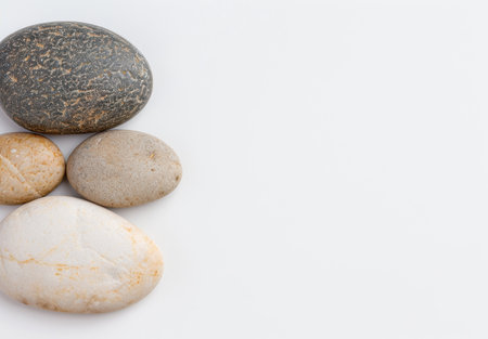 Smooth river stones on a white backgroundの素材