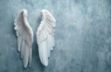 Angelic white wings on a textured backgroundの素材