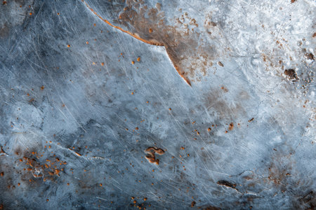Weathered metal surface with rust and scratchesの素材
