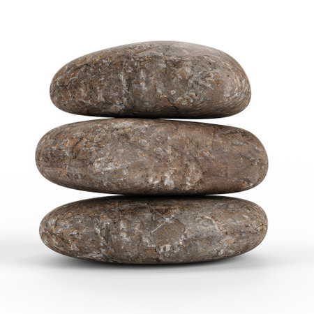 Stacked river rocks on white backgroundの素材