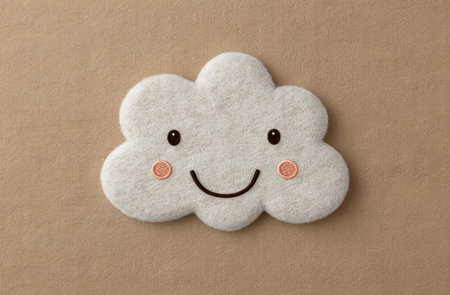 Cute plush cloud with smiling faceの素材