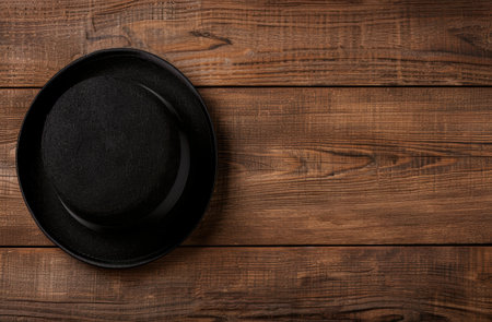 black hat on wooden tableの素材