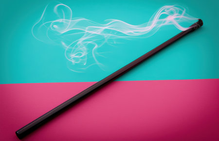 Incense smoke swirling against vibrant backgroundの素材