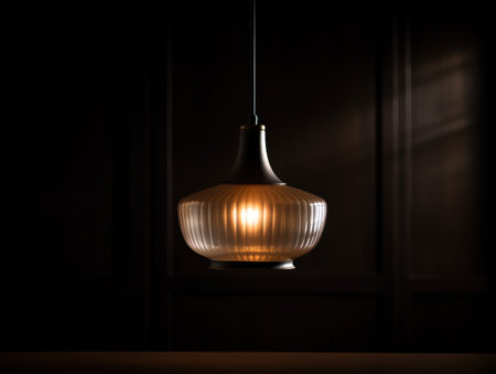 Illuminating pendant lamp in a dark roomの素材