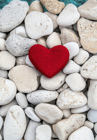 Red heart on white stonesの素材