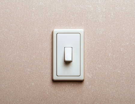 simple light switch on beige wallの素材
