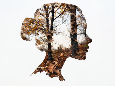 silhouette of a woman's profile with autumn leavesの素材