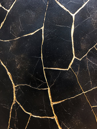 Elegant black marble texture with golden veinsの素材