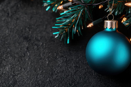 Festive christmas ornament and lights on a dark backgroundの素材
