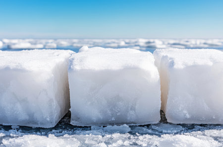 Frozen winter landscape with snow-covered blocks of iceの素材