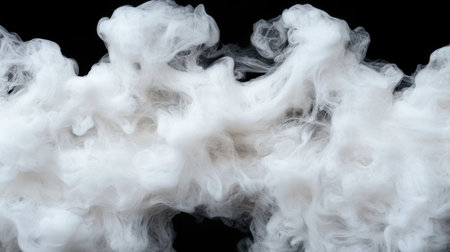 Swirling white smoke on black backgroundの素材
