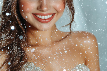 Smiling woman enjoying the snowの素材