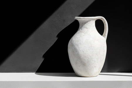 Minimalist ceramic vase on a shelfの素材