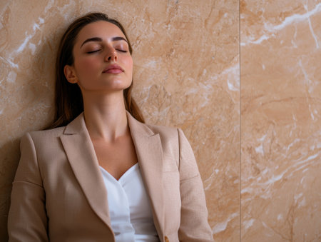 Thoughtful businesswoman with eyes closedの素材