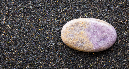 Amethyst crystal on pebble beachの素材