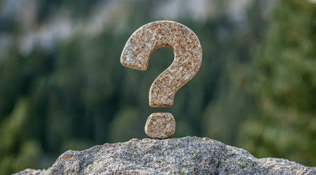 Question mark symbol on rockの素材