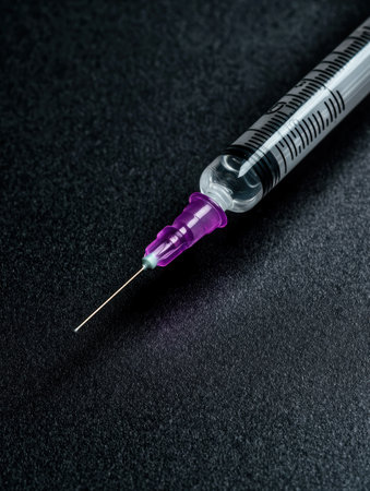 medical syringe on dark backgroundの素材