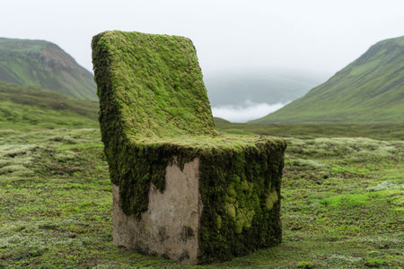 Moss-covered chair in a serene mountain landscapeの素材