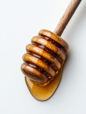 Honey dripping from wooden dipperの素材