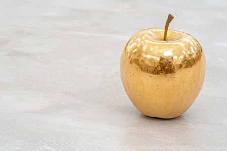 golden apple on white backgroundの素材