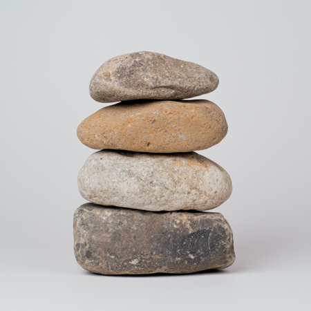 Stacked river rocks in neutral tonesの素材