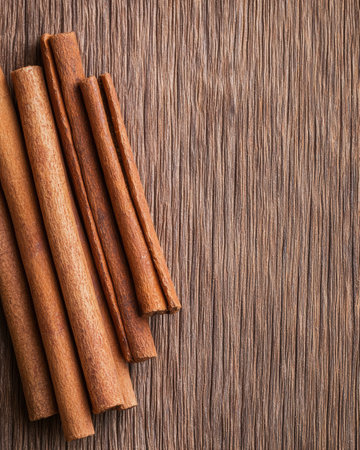 Cinnamon sticks on wooden backgroundの素材