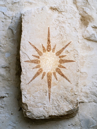 ancient stone carving of a sun symbolの素材