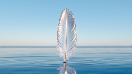 Serene feather floating on calm waterの素材