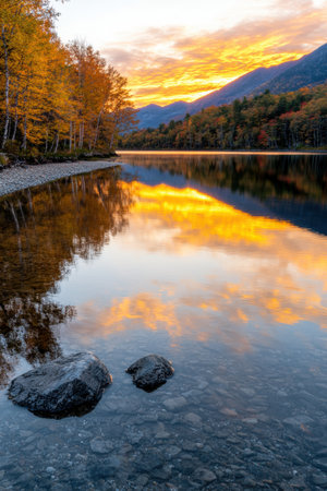 Stunning autumn sunset over mountain lakeの素材