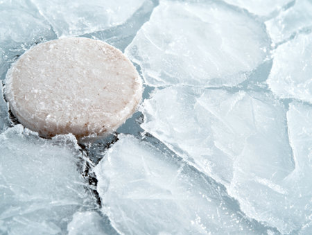 Frozen ice cube on icy surfaceの素材