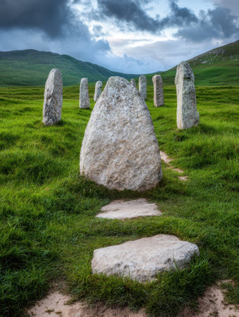 ancient stone monoliths in a lush green fieldの素材