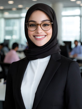 smiling woman in hijab wearing glassesの素材