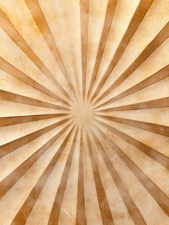 Radiant sunburst pattern on textured paperの素材