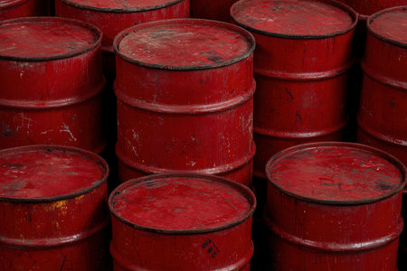 Stacked red metal oil drumsの素材