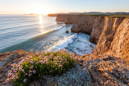 Stunning coastal landscape with crashing waves and blooming flowersの素材