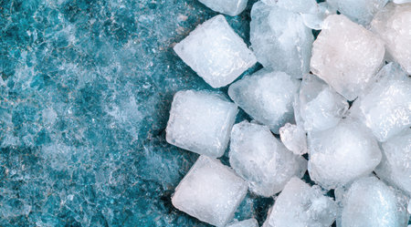 Frozen ice cubes on a turquoise backgroundの素材