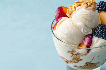 Delicious ice cream sundae with fresh fruit and crunchy toppingsの素材