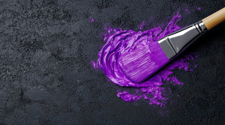 Vibrant purple paint splash with paintbrushの素材