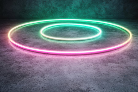 Glowing neon rings on concrete backgroundの素材