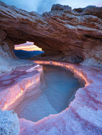 Stunning desert landscape with natural pool at sunsetの素材