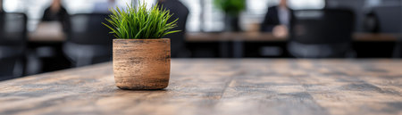Potted plant on wooden table in officeの素材