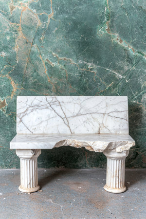Marble bench with columns in front of green marble wallの素材