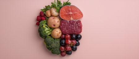 Heart-shaped arrangement of healthy food on pink backgroundの素材