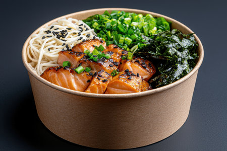 Delicious salmon poke bowl with noodles and seaweedの素材