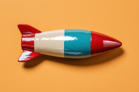 Retro rocket toy on orange backgroundの素材