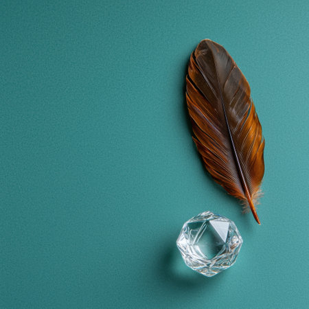 Brown feather and crystal on teal backgroundの素材