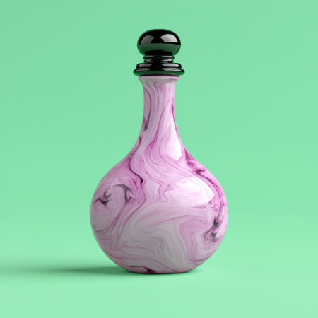Pink marble perfume bottle with black lid on green backgroundの素材