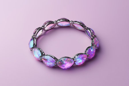 Elegant purple gemstone bracelet on pink backgroundの素材